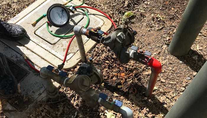 Testing a small backflow preventer on Saint Helena Highway